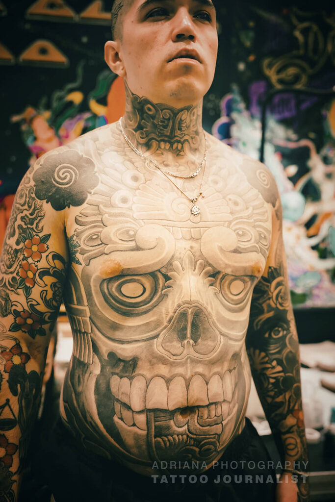 chicano black and grey skull on torso, by Antonio Mejia,  photo copyright adriana de barros
