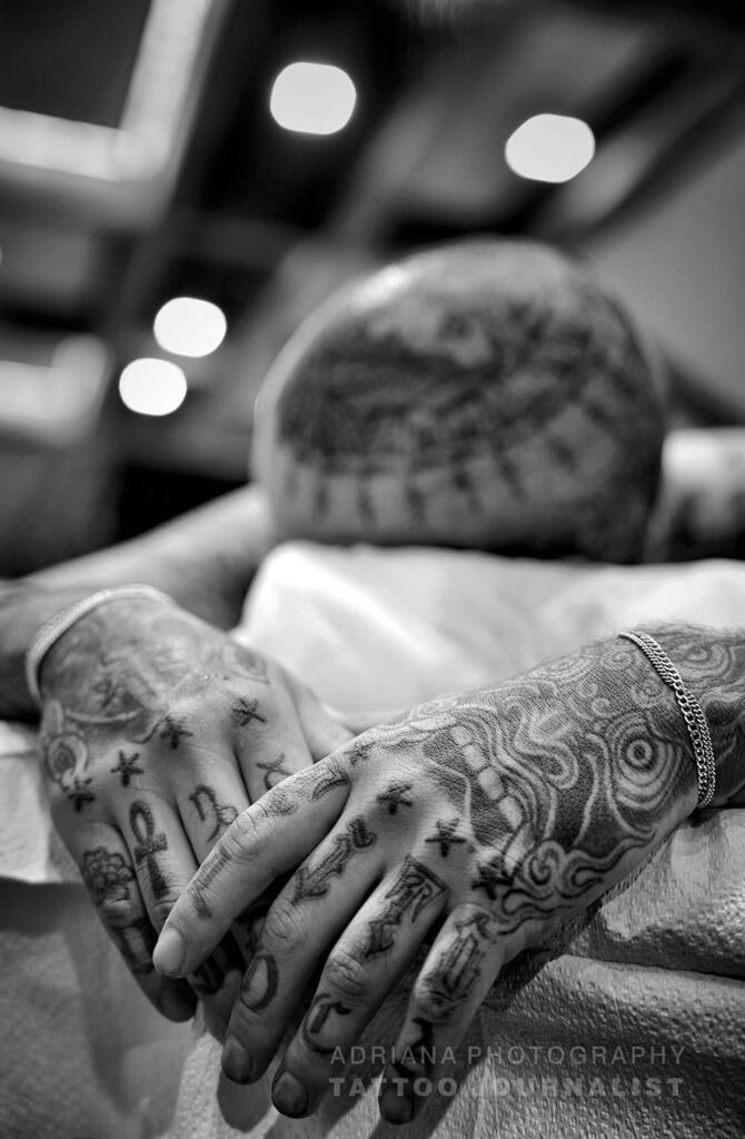 black and grey head and hand tattoos,  photo copyright adriana de barros